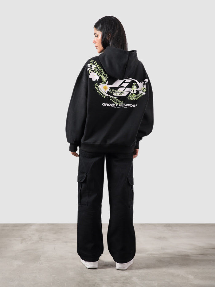 Floral hoodie male model half body lifestyle shot Pakistan – GROOVY